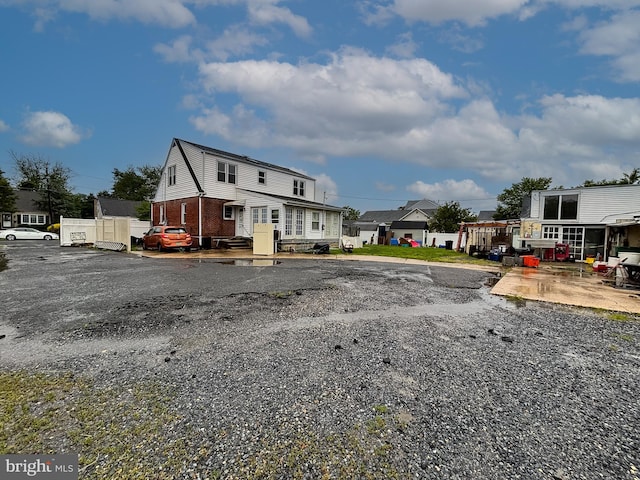 121 E Lafayette Ave, Magnolia, NJ 08049 - view of front of home with brick siding and a residential view
