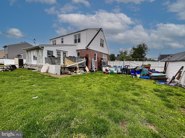 121 E Lafayette Ave, Magnolia, NJ 08049 - back of property with brick siding and a wooden deck