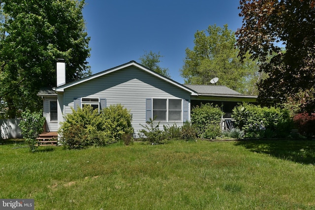 3703 Spruce St, Bristol, PA 19007 - exterior space with a yard and a chimney