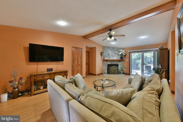 3703 Spruce St, Bristol, PA 19007 - living area featuring a ceiling fan, a stone fireplace, baseboards, lofted ceiling with beams, and light wood finished floors