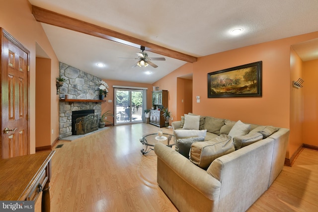 3703 Spruce St, Bristol, PA 19007 - living area with ceiling fan, a fireplace, wood finished floors, baseboards, and vaulted ceiling with beams