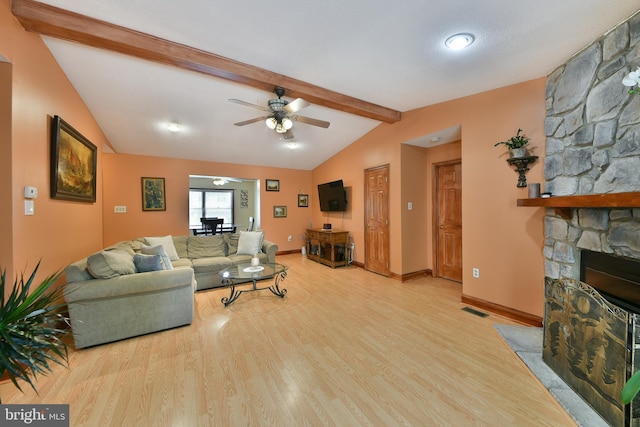 3703 Spruce St, Bristol, PA 19007 - living area featuring ceiling fan, visible vents, a fireplace, wood finished floors, and vaulted ceiling with beams