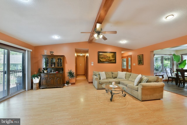 3703 Spruce St, Bristol, PA 19007 - living area with light wood-style floors, ceiling fan, lofted ceiling with beams, and a wealth of natural light