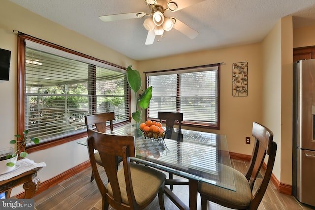 3703 Spruce St, Bristol, PA 19007 - dining space featuring baseboards, ceiling fan, and light wood-style floors