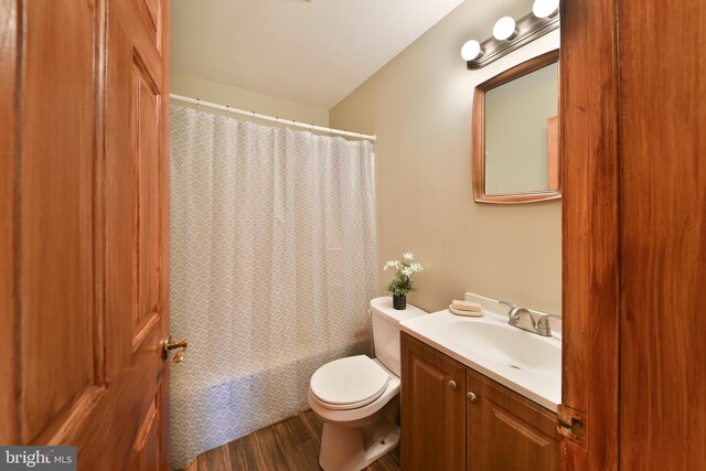 3703 Spruce St, Bristol, PA 19007 - full bath featuring toilet, wood finished floors, shower / bath combo, and vanity