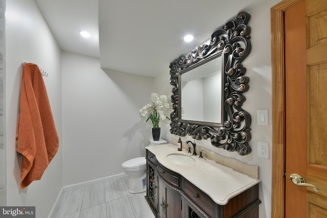 3703 Spruce St, Bristol, PA 19007 - half bathroom featuring recessed lighting, baseboards, vanity, and toilet