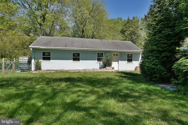 3703 Spruce St, Bristol, PA 19007 - view of front of house featuring fence and a front yard