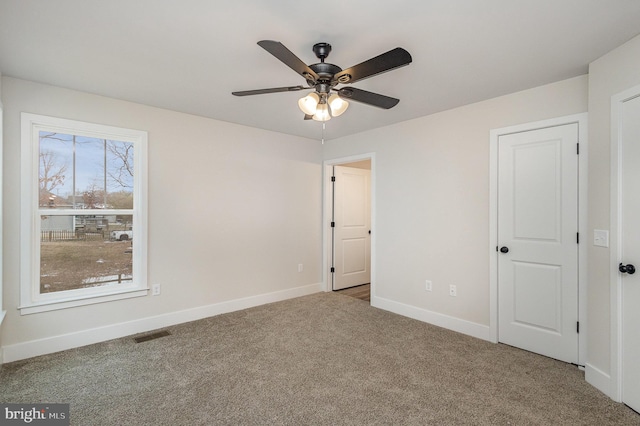 5 Cornwallis Cv, Ruther Glen, VA 22546 - unfurnished bedroom featuring baseboards, visible vents, a ceiling fan, and carpet