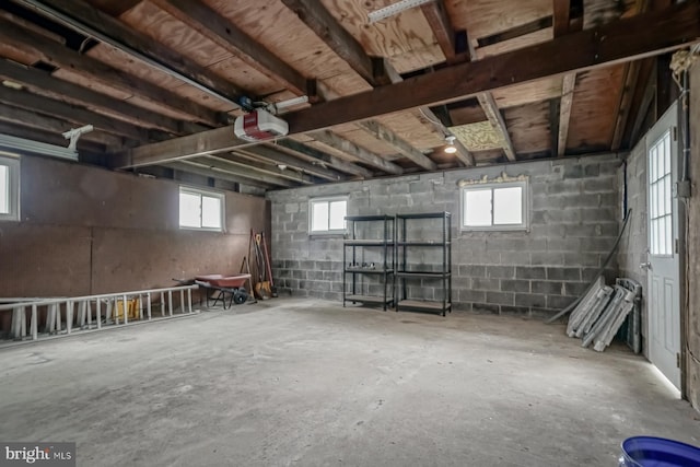 below grade area with healthy amount of natural light and concrete block wall