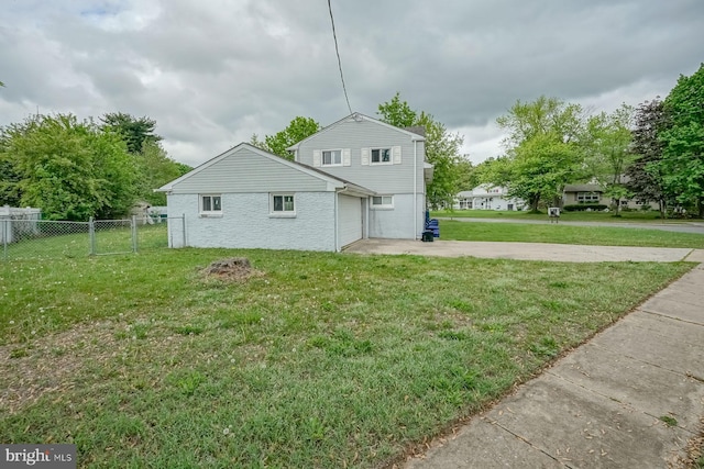 back of property featuring concrete driveway