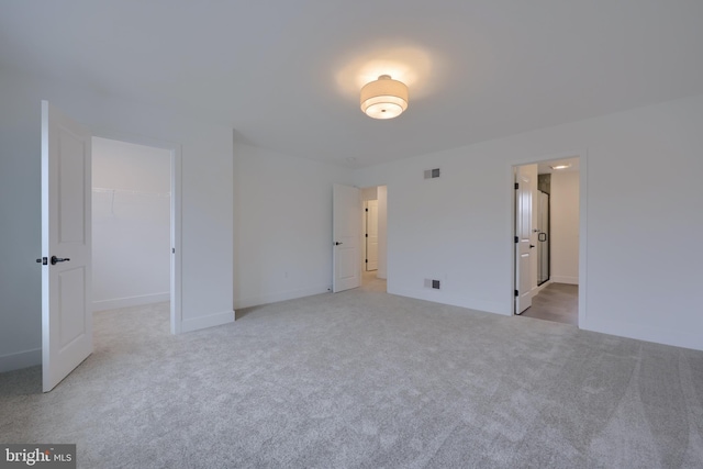 520 Woodcrest Ave, Lititz, PA 17543 - unfurnished bedroom featuring light colored carpet, visible vents, a closet, baseboards, and a spacious closet