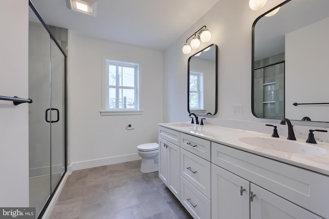 520 Woodcrest Ave, Lititz, PA 17543 - bathroom featuring baseboards, a stall shower, double vanity, and a sink