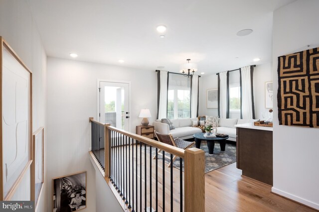 living room featuring an inviting chandelier, recessed lighting, and light wood finished floors