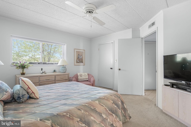 423 14th St Unit 205K, Ocean City, MD 21842 - bedroom with light colored carpet, a textured ceiling, visible vents, crown molding, and a ceiling fan