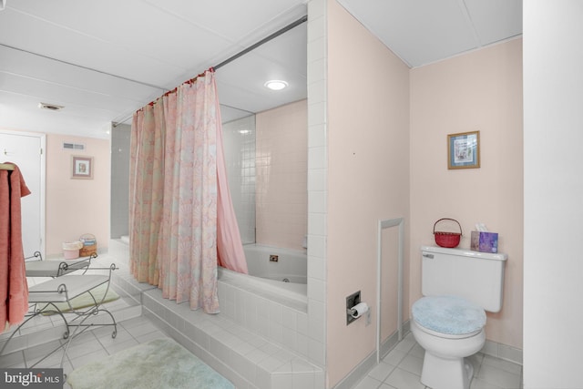 423 14th St Unit 205K, Ocean City, MD 21842 - full bathroom featuring toilet, baseboards, tiled shower / bath, visible vents, and tile patterned floors