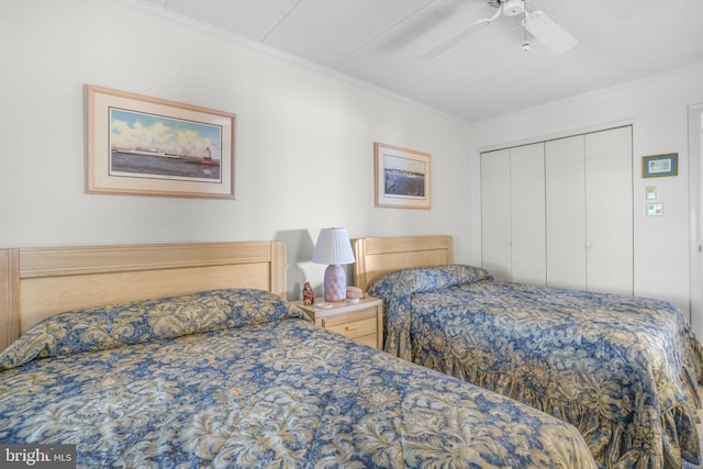 423 14th St Unit 205K, Ocean City, MD 21842 - bedroom featuring ornamental molding, a closet, and a ceiling fan