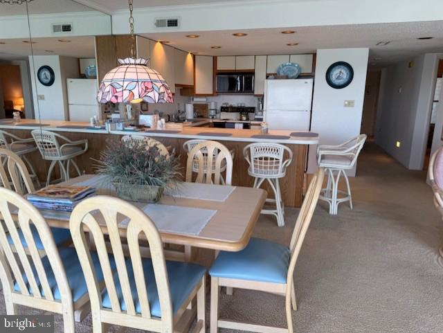 423 14th St Unit 205K, Ocean City, MD 21842 - carpeted dining space featuring visible vents