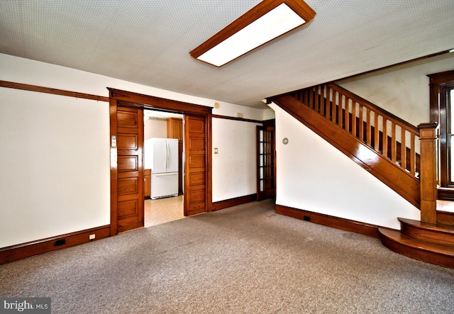 133 Main St, East Greenville, PA 18041 - unfurnished living room with carpet, stairway, and baseboards