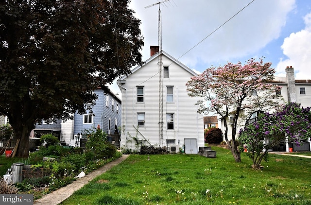 133 Main St, East Greenville, PA 18041 - view of side of property with a chimney and a lawn