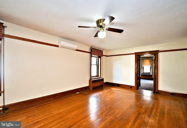 133 Main St, East Greenville, PA 18041 - unfurnished room with an AC wall unit, ceiling fan, wood-type flooring, and baseboards
