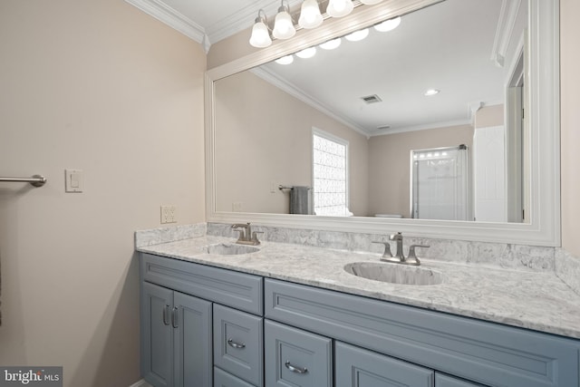 bathroom featuring visible vents, a sink, crown molding, and double vanity