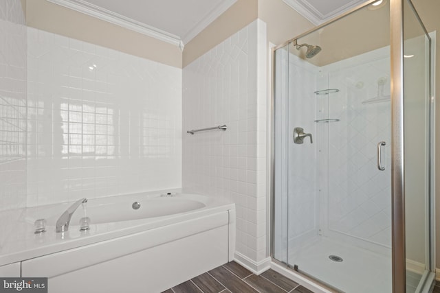 full bath with crown molding, a garden tub, a shower stall, and wood finished floors