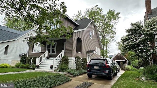view of front facade featuring a porch and stairway