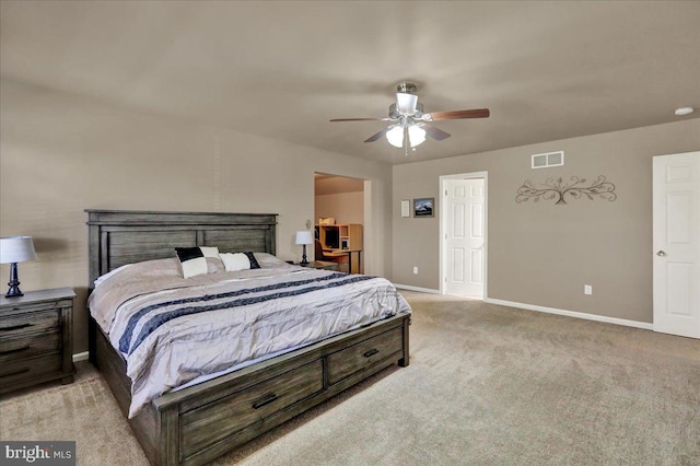 bedroom with light colored carpet, visible vents, ceiling fan, and baseboards