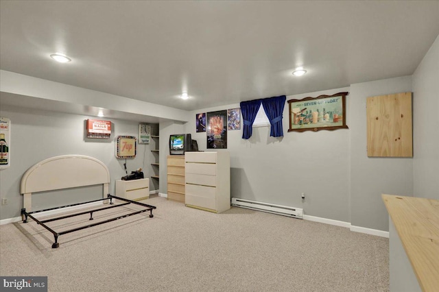 interior space featuring a baseboard heating unit, recessed lighting, carpet, and baseboards