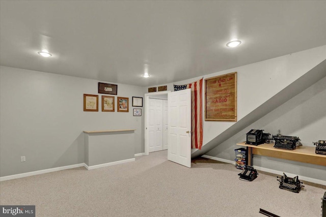 exercise room with recessed lighting, light colored carpet, and baseboards