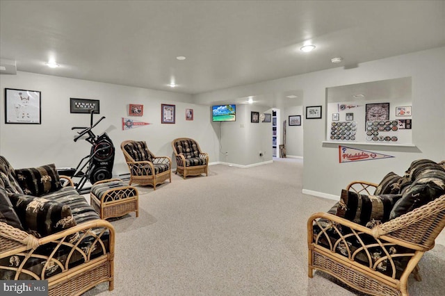 carpeted living area with recessed lighting and baseboards