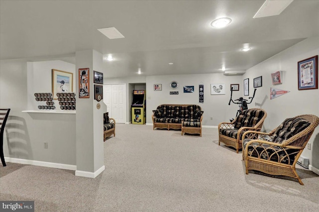 sitting room featuring baseboards and carpet floors