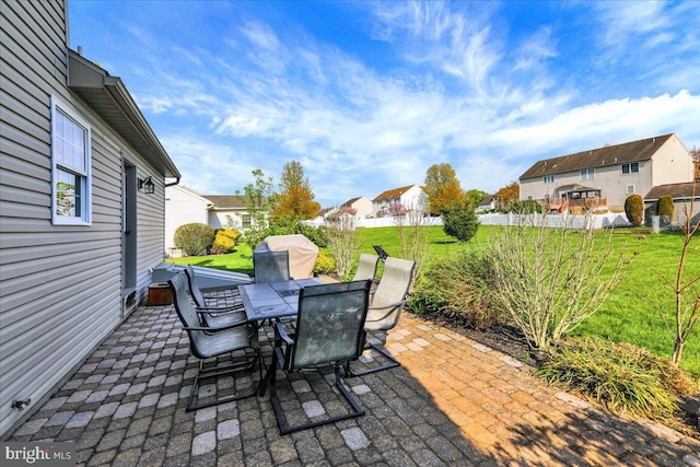 view of patio / terrace with outdoor dining space and a residential view