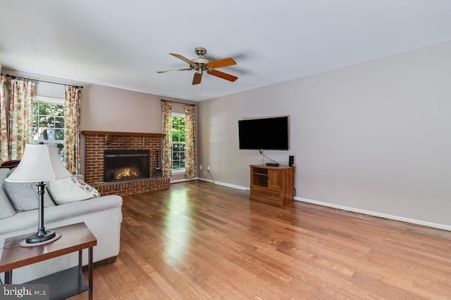 10995 Alcorn Ln, Waldorf, MD 20603 - unfurnished living room with ceiling fan, wood finished floors, baseboards, and a fireplace