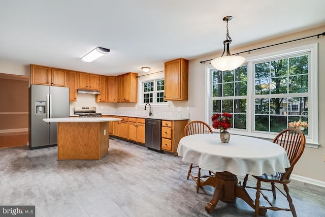 10995 Alcorn Ln, Waldorf, MD 20603 - kitchen with stainless steel appliances, a center island, plenty of natural light, and light countertops