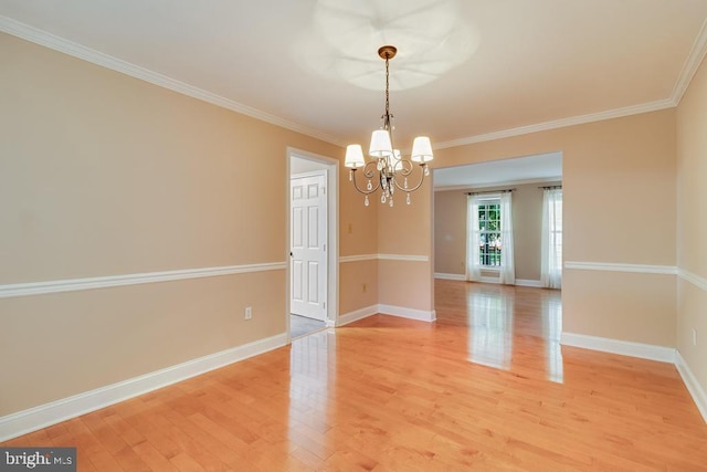 10995 Alcorn Ln, Waldorf, MD 20603 - empty room with a chandelier, light wood-type flooring, baseboards, and ornamental molding