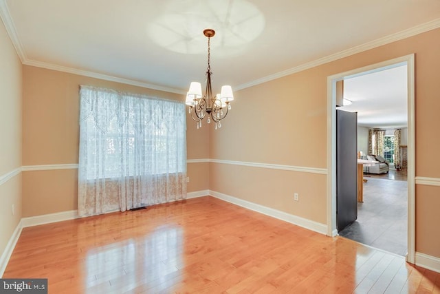 10995 Alcorn Ln, Waldorf, MD 20603 - empty room with wood finished floors, a chandelier, ornamental molding, and baseboards