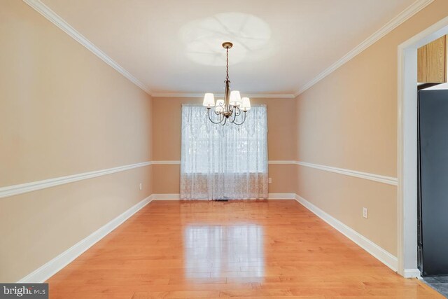10995 Alcorn Ln, Waldorf, MD 20603 - unfurnished dining area with a chandelier, light wood finished floors, baseboards, and crown molding