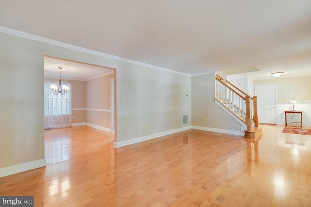 10995 Alcorn Ln, Waldorf, MD 20603 - unfurnished living room featuring stairway, light wood-style floors, a chandelier, crown molding, and baseboards