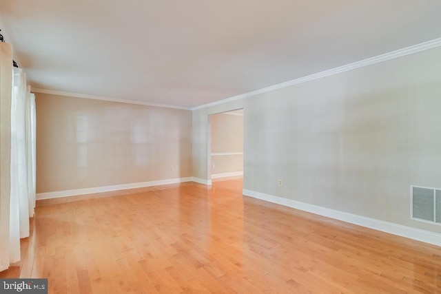 10995 Alcorn Ln, Waldorf, MD 20603 - empty room with crown molding, light wood-style flooring, and baseboards