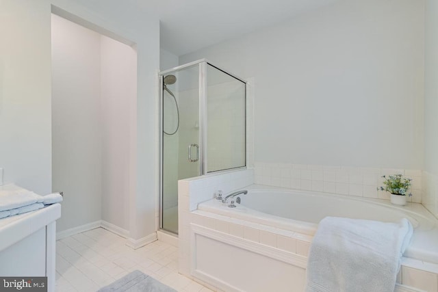 10995 Alcorn Ln, Waldorf, MD 20603 - bathroom with a stall shower, tile patterned floors, and a bath
