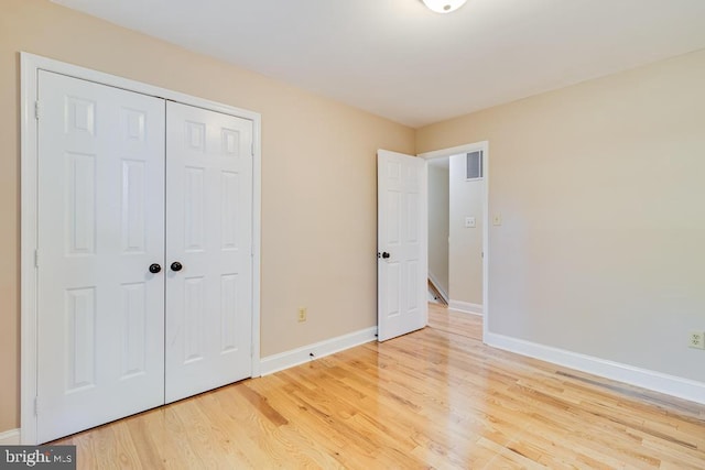 10995 Alcorn Ln, Waldorf, MD 20603 - unfurnished bedroom with light wood-style floors, baseboards, and a closet