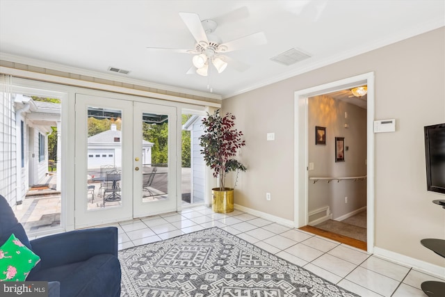 entryway with light tile patterned floors, baseboards, ceiling fan, and french doors