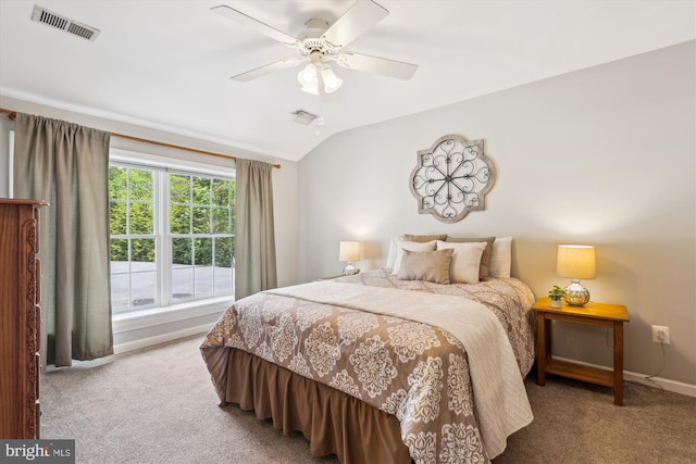 carpeted bedroom featuring baseboards, visible vents, ceiling fan, and vaulted ceiling