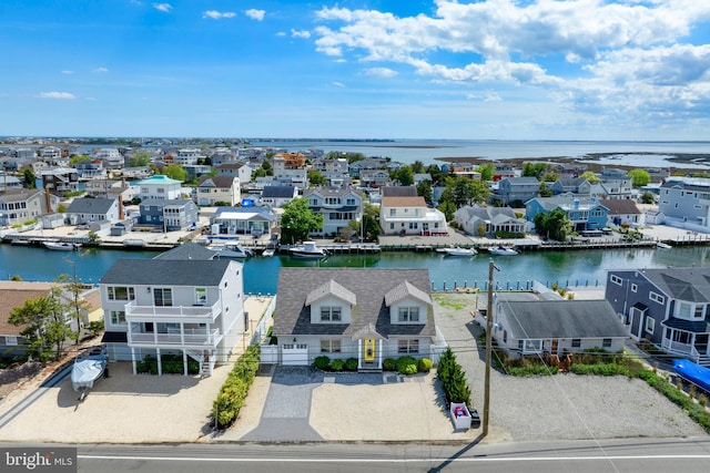 aerial perspective of suburban area featuring a nearby body of water