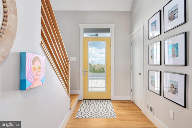 entryway featuring light wood-type flooring and baseboards