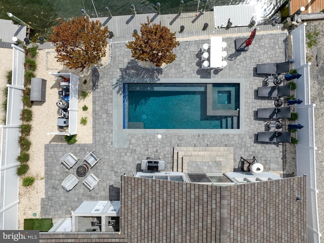 view of subject property with a pool area