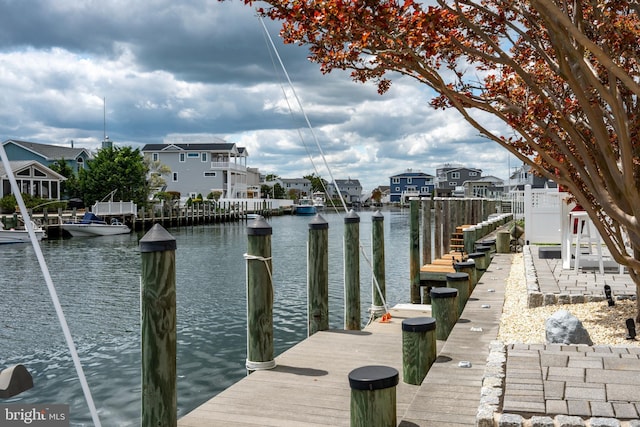 dock with a water view and a residential view