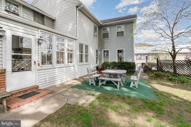 rear view of house with a patio area and entry steps