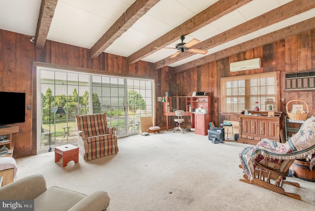 carpeted living room with wood walls, beam ceiling, ceiling fan, and a wall unit AC
